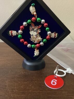Handcrafted upcycled Christmas jewelry art pug candles red green gold charms art